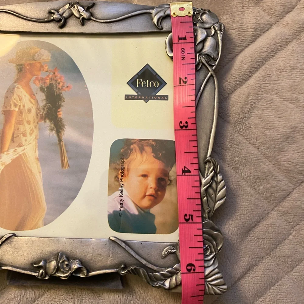 Fetco International Silver Floral Photo Frame stand is tight.  OSP